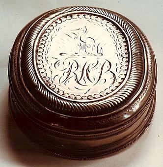 A silver snuff box which originally belonged to Thomas Harris of Canterbury. It came down through the Barham  family to Richard Harris Barham, who had his crest engraved on one side of it.